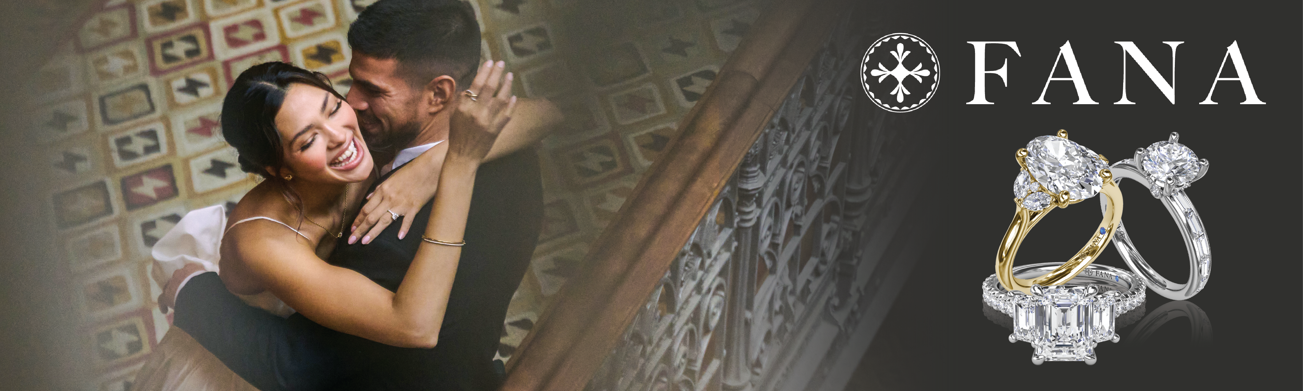 A romantic image of a joyful couple embracing on a staircase, with the woman in a white wedding dress and the man in a dark suit. To the right, the Fana jewelry brand logo is displayed above three luxurious diamond engagement rings—one with a yellow gold band and oval diamond, one with a white gold band and round diamond, and one with a platinum band and emerald-cut diamond surrounded by smaller stones. The background features an ornate tiled floor and a wrought-iron banister.