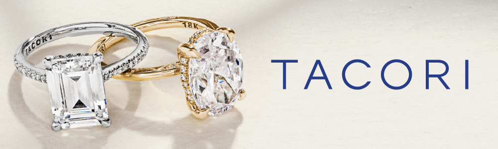 Two elegant diamond engagement rings are displayed on a light surface. The ring on the left features a large emerald-cut diamond set in a platinum band with the brand name 