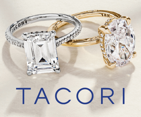 Two elegant diamond engagement rings are displayed on a light surface. The ring on the left features a large emerald-cut diamond set in a platinum band with the brand name 